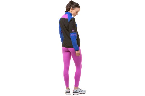 Model wearing the ronhill women's tech Gortex Windstopper Jacket, front view with zip closed, back view