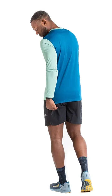 Ronhill's men's running t-shirt. Willow Marl Prussian blue logo, on model, back view.