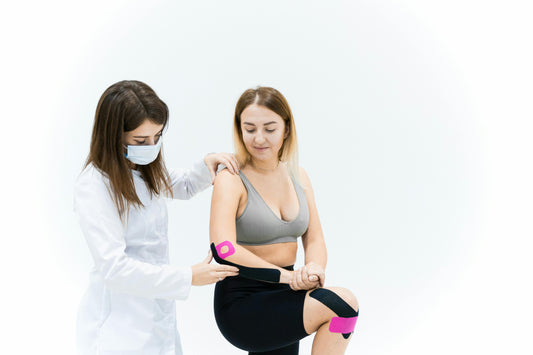 Photo by Maksim Goncharenok: https://www.pexels.com/photo/a-medical-practitioner-treating-a-woman-with-kinesio-tape-6094047/