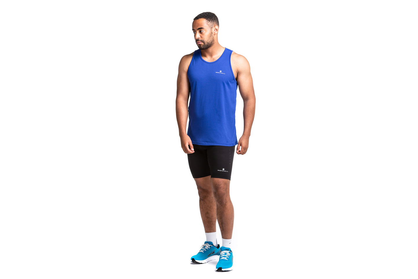 Mens tank top - Mens core vest by Ronhill. Front view shows a person wearing the tank top and the top is in a dark cobalt colour.