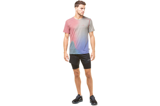 Men's Tee - Tech Golden Hour Tee by Ronhill, designed to keep you cool when the temperature rises with polartec delta fabric. Multicoloured design reminiscent of the golden glow of dusk and dawn. Photo shows the front view of the t-shirt worn by someone.