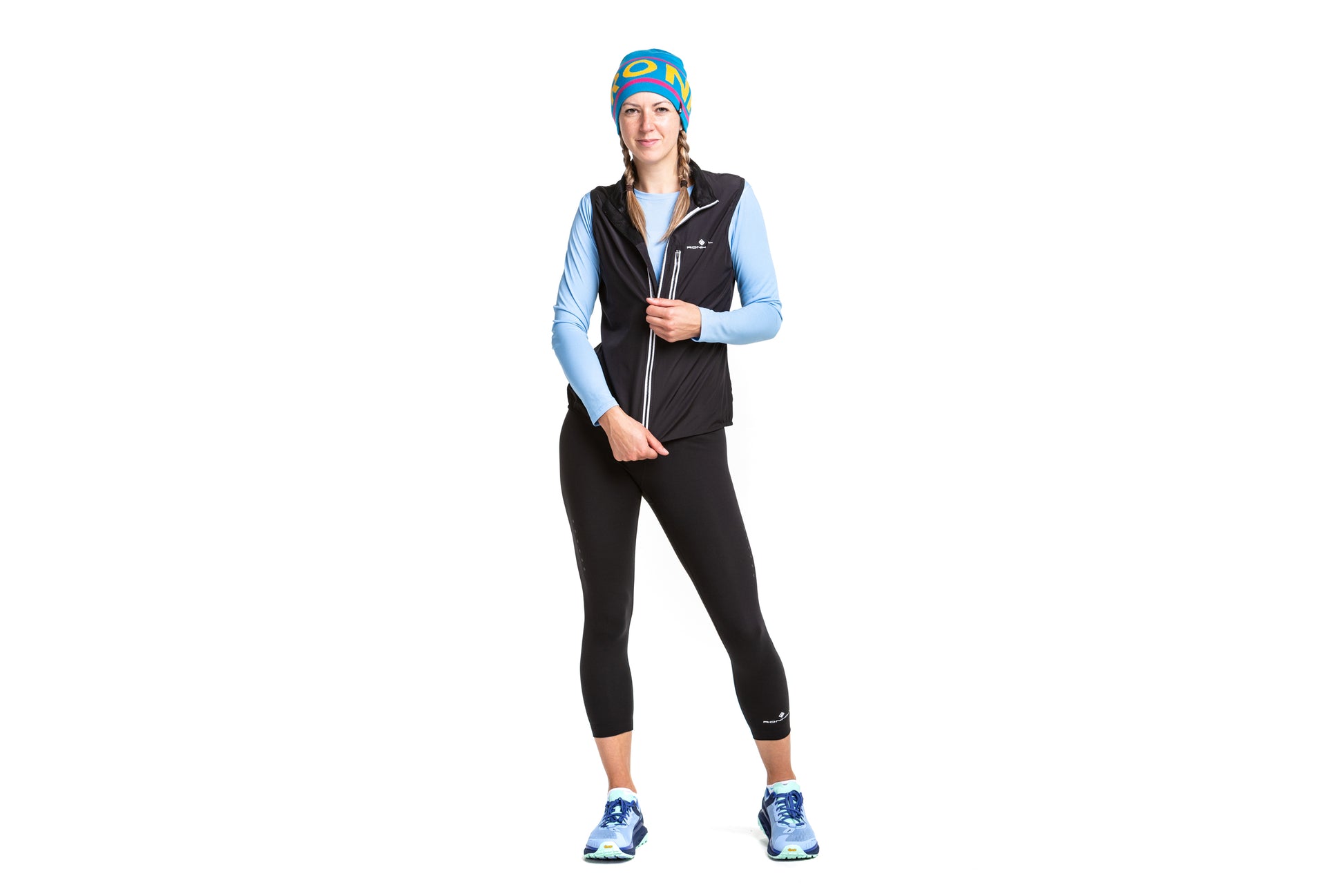 Women's Gilet (Sleeveless Jacket otherwise known as a Tank) by Ronhill in Black colour - Front view of a person wearing the jacket