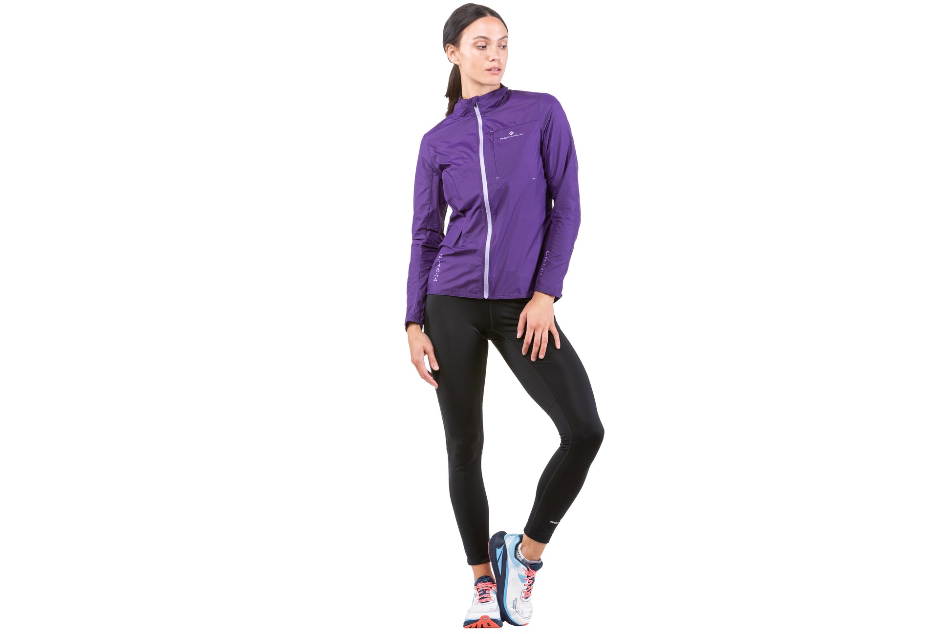 Women's Jacket - Women's Tech LTW Jacket by Ronhill. This jacket is light with a perfect balance of breathability and wind resistance and will keep you protected during days when it's drizzly and gusty. This jacket is in an imperial ultra violet colour. The jacket in this picture is a front view of a person wearing the jacket.