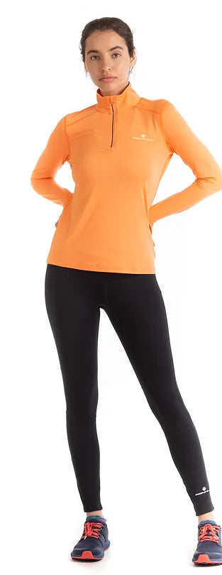 Ronhill's Womens Tech Thermal Running Zip T-shirt.  Long Sleeves. Peach and lemon grass. Shown on model, front view