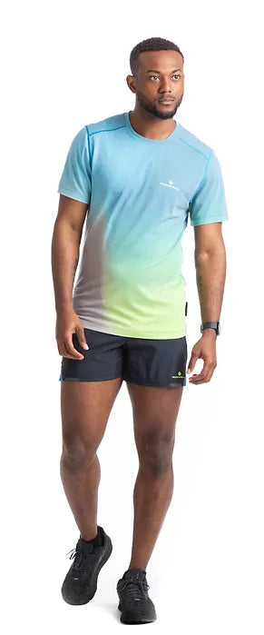 Ronhill's Men's Short Sleeve Running Tech Golden Hour t-shirt. Cyan Acid Lime merge, Front view shown on model